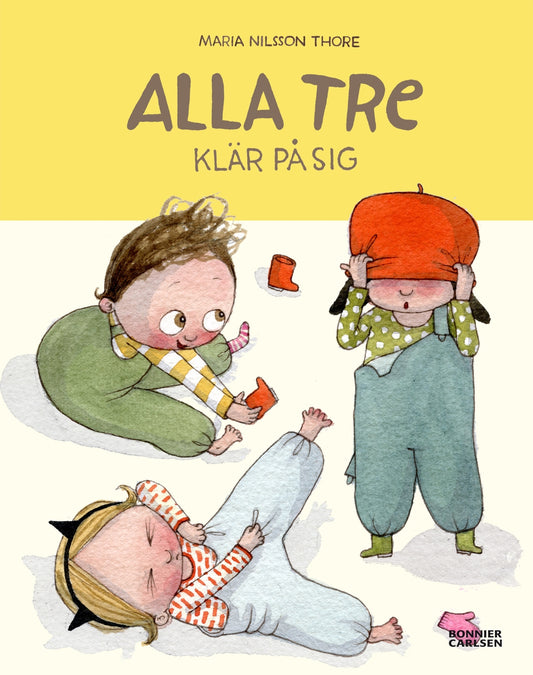 Alla tre klär på sig